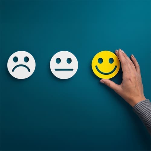 choosing happy face among sad faces